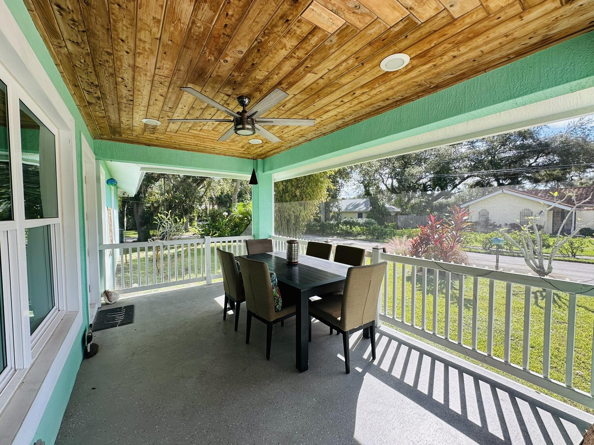 2415 Laurel Lane Palm Beach Gardens, FL 33410 - Photo 2 of 18 a view of a chairs and table in the balcony