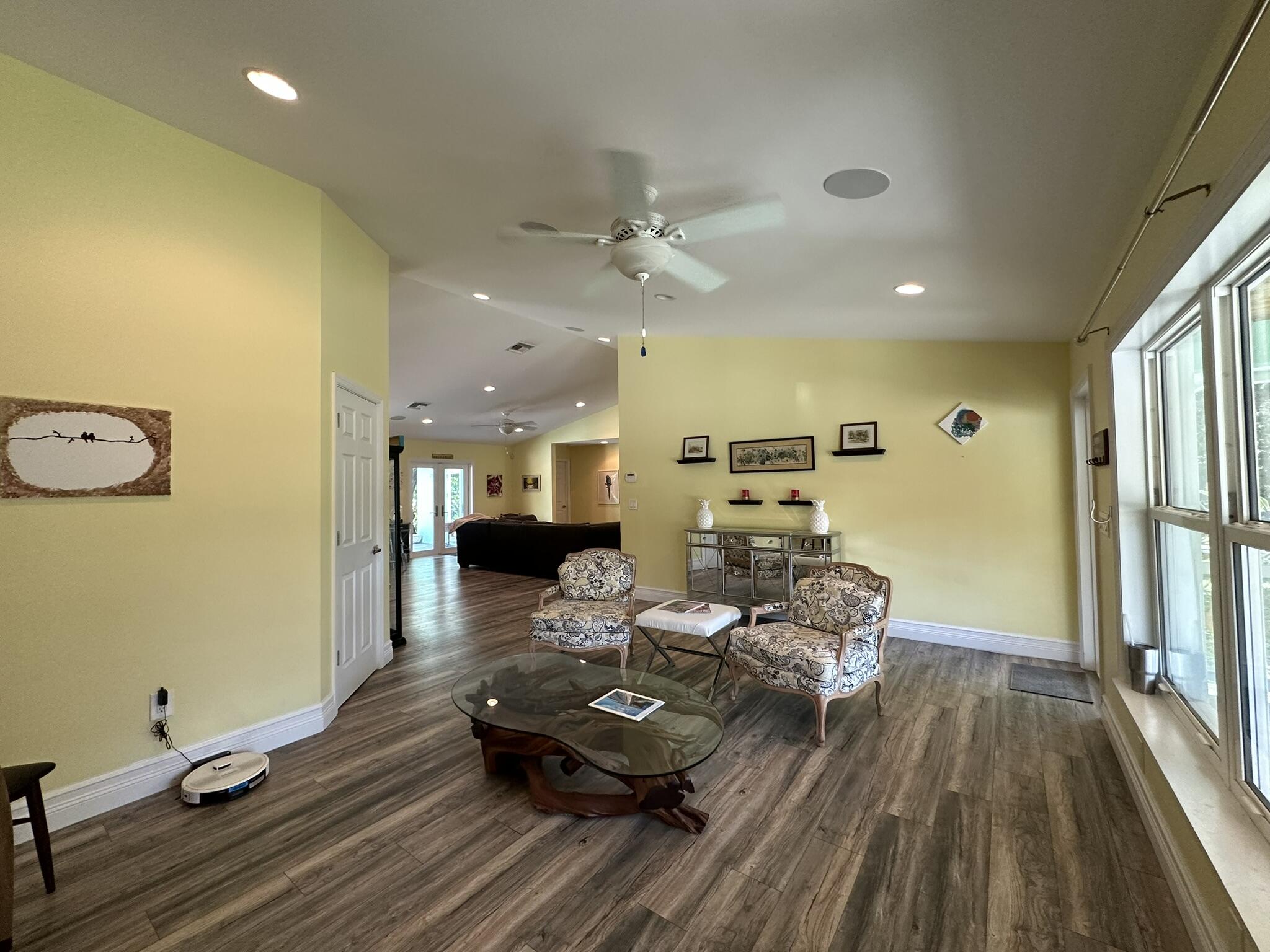 2415 Laurel Lane Palm Beach Gardens, FL 33410 - Photo 4 of 18 a living room with furniture and wooden floor