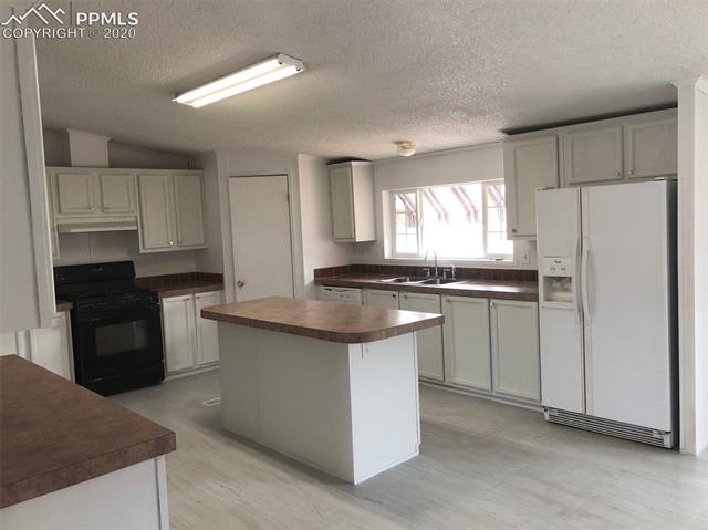 1200 Forest Road Colorado Springs, CO 80906 - Photo 4 of 40 Kitchen, Island