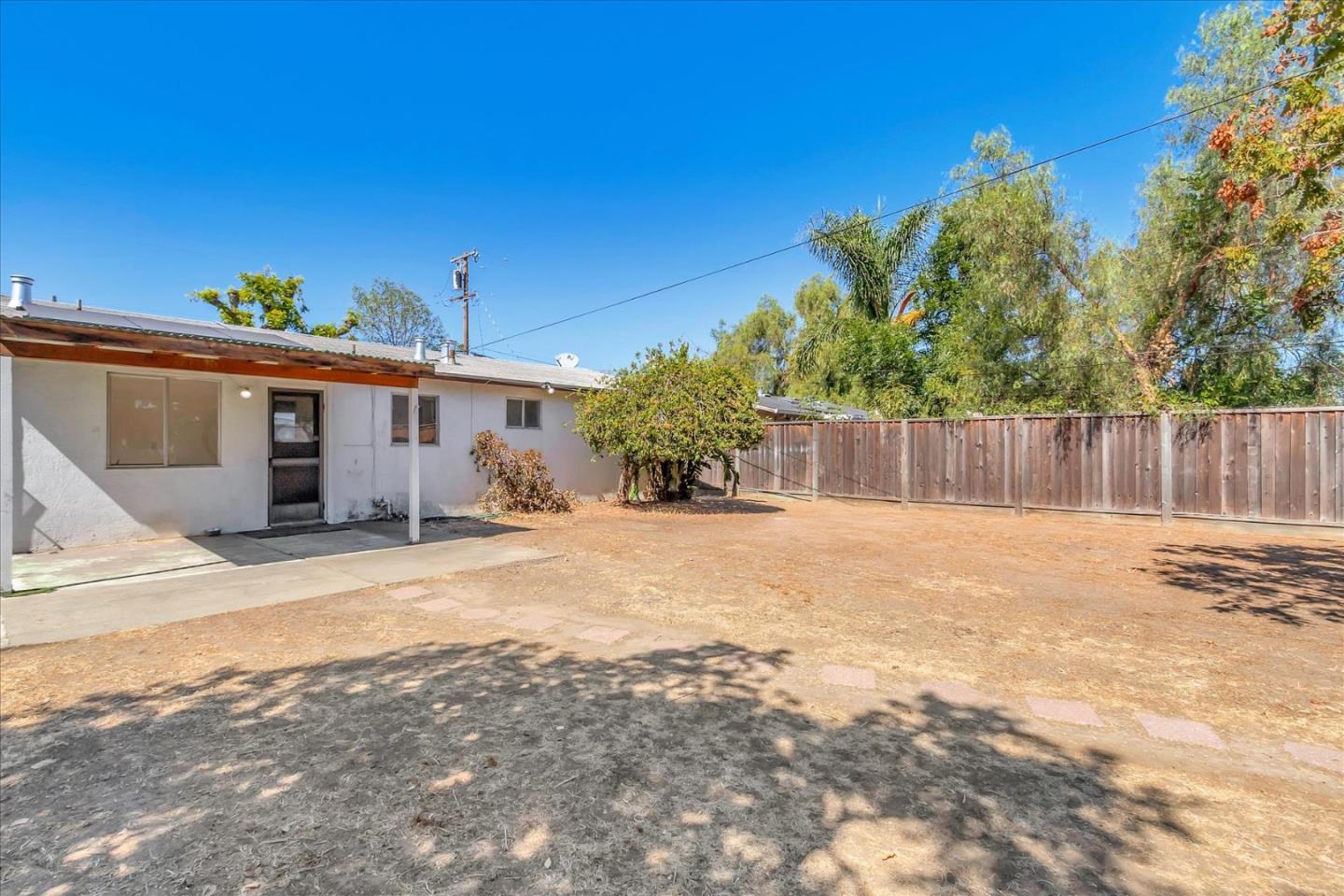 1290 Hoffman Lane Campbell, CA 95008 - Photo 2 of 5 a front view of a house with a yard and garage