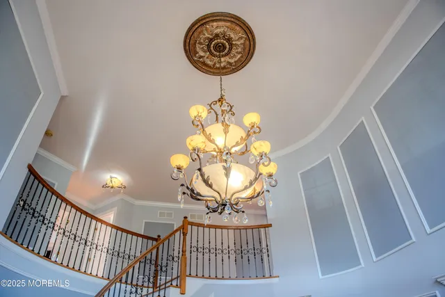 a kitchen with stainless steel appliances granite countertop a sink a counter space and a window
