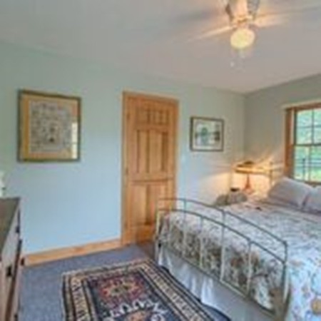 309 Boston Road Groton, MA 01450 - Photo 18 of 21 a bedroom with a bed and a window