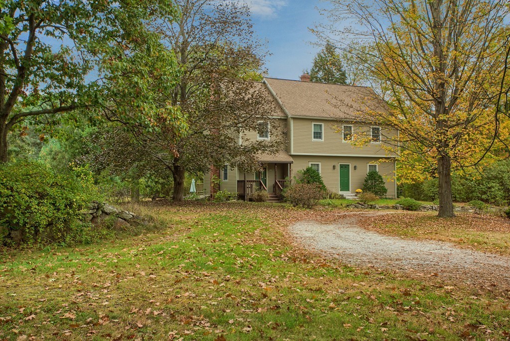 309 Boston Road Groton, MA 01450 - Photo 3 of 21 a front view of a house with a yard