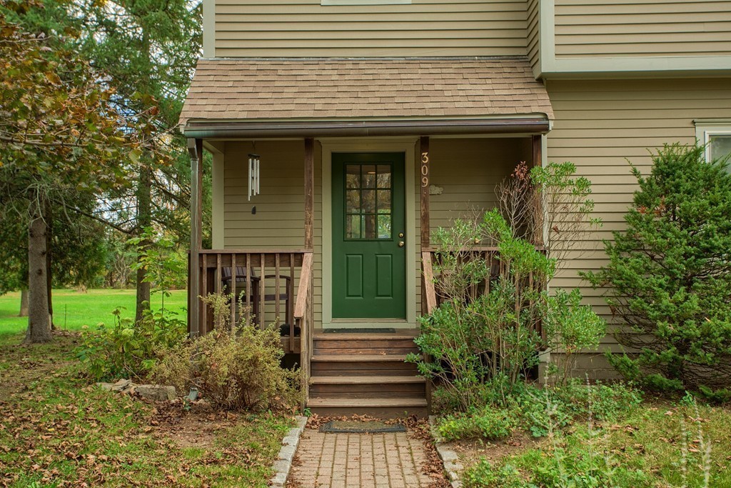 309 Boston Road Groton, MA 01450 - Photo 4 of 21 a front view of a house with garden