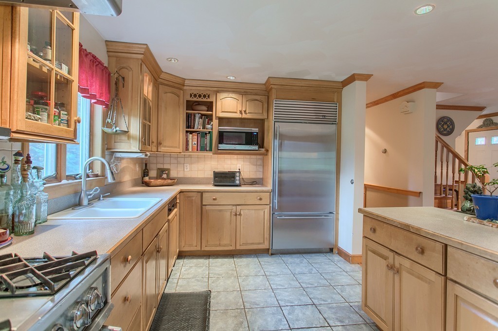 309 Boston Road Groton, MA 01450 - Photo 9 of 21 a kitchen with a sink stove and refrigerator