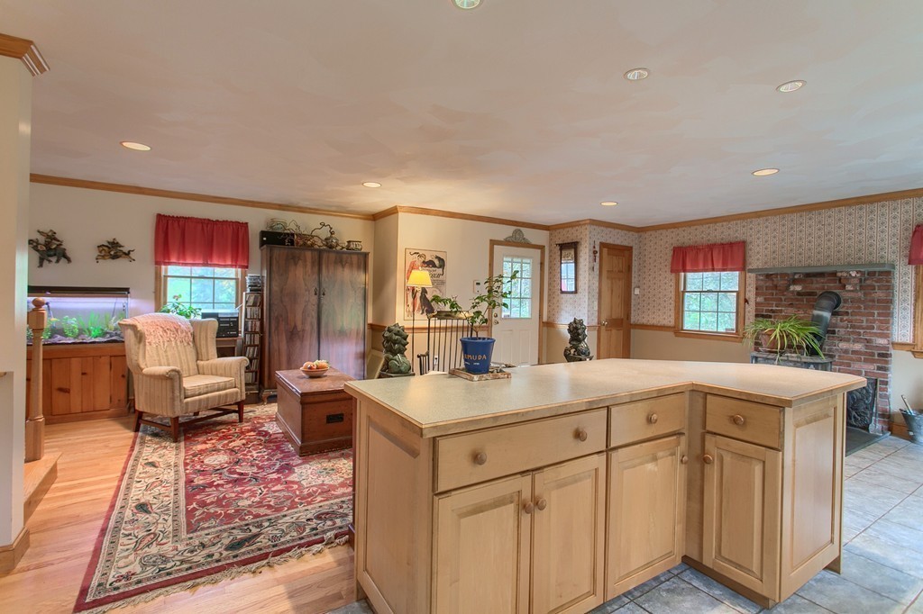 309 Boston Road Groton, MA 01450 - Photo 10 of 21 a view of living room with stainless steel appliances granite countertop furniture and a kitchen view