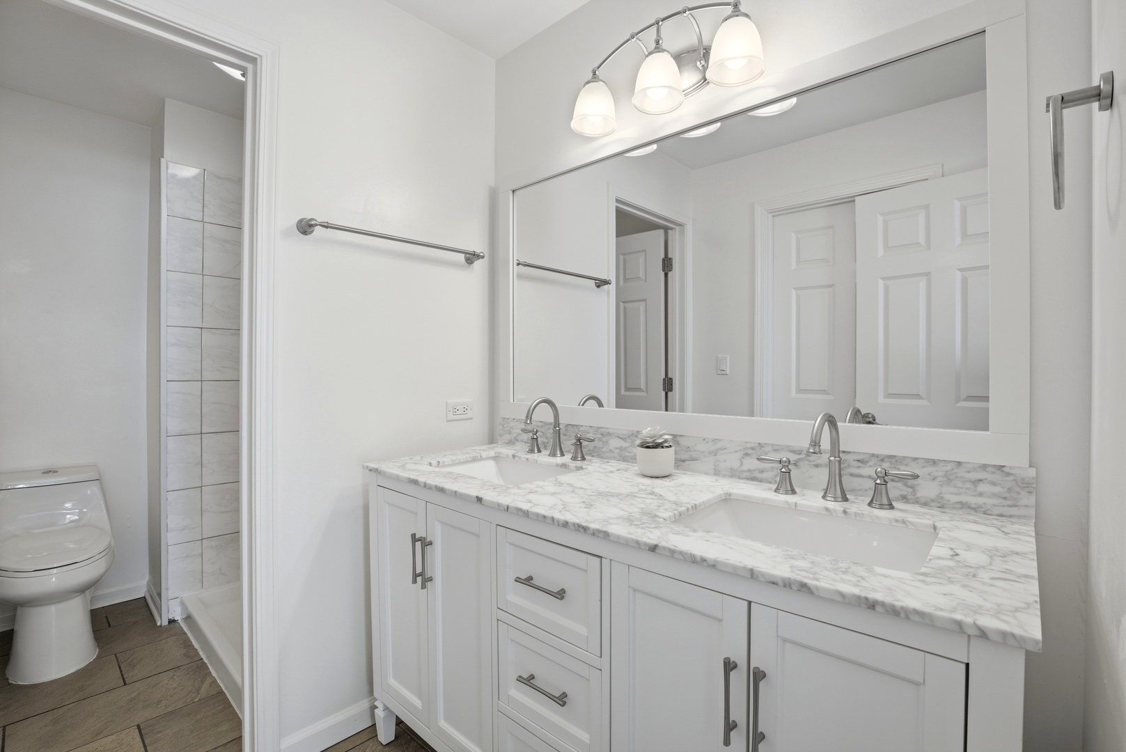 622 Zaininger Avenue, Unit A Naperville, IL 60563 - Photo 17 of 30 a bathroom with a granite countertop sink a toilet and a mirror