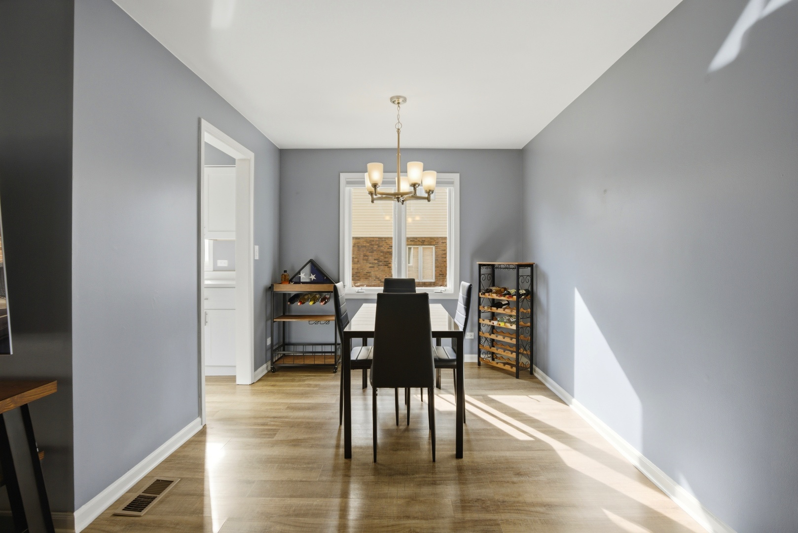 622 Zaininger Avenue, Unit A Naperville, IL 60563 - Photo 7 of 30 a view of a dining room with furniture window and wooden floor
