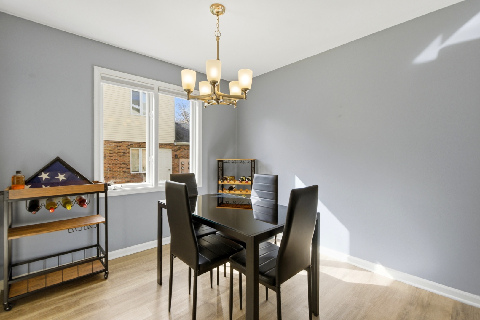 622 Zaininger Avenue, Unit A Naperville, IL 60563 - Photo 9 of 30 a view of a dining room with furniture window and wooden floor