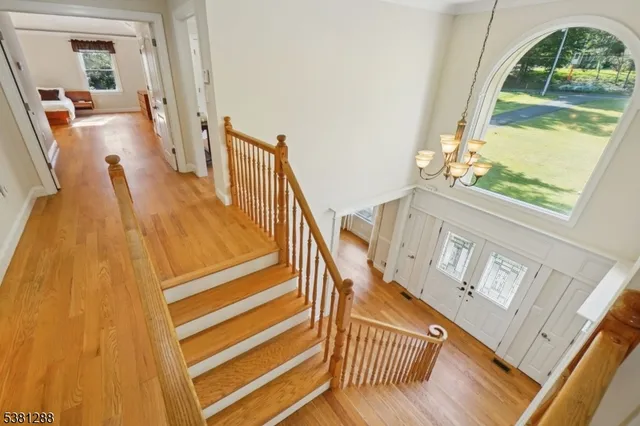 a view of an entryway with wooden floor