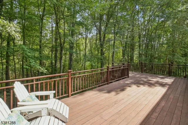a view of a two chairs and table on the wooden floor