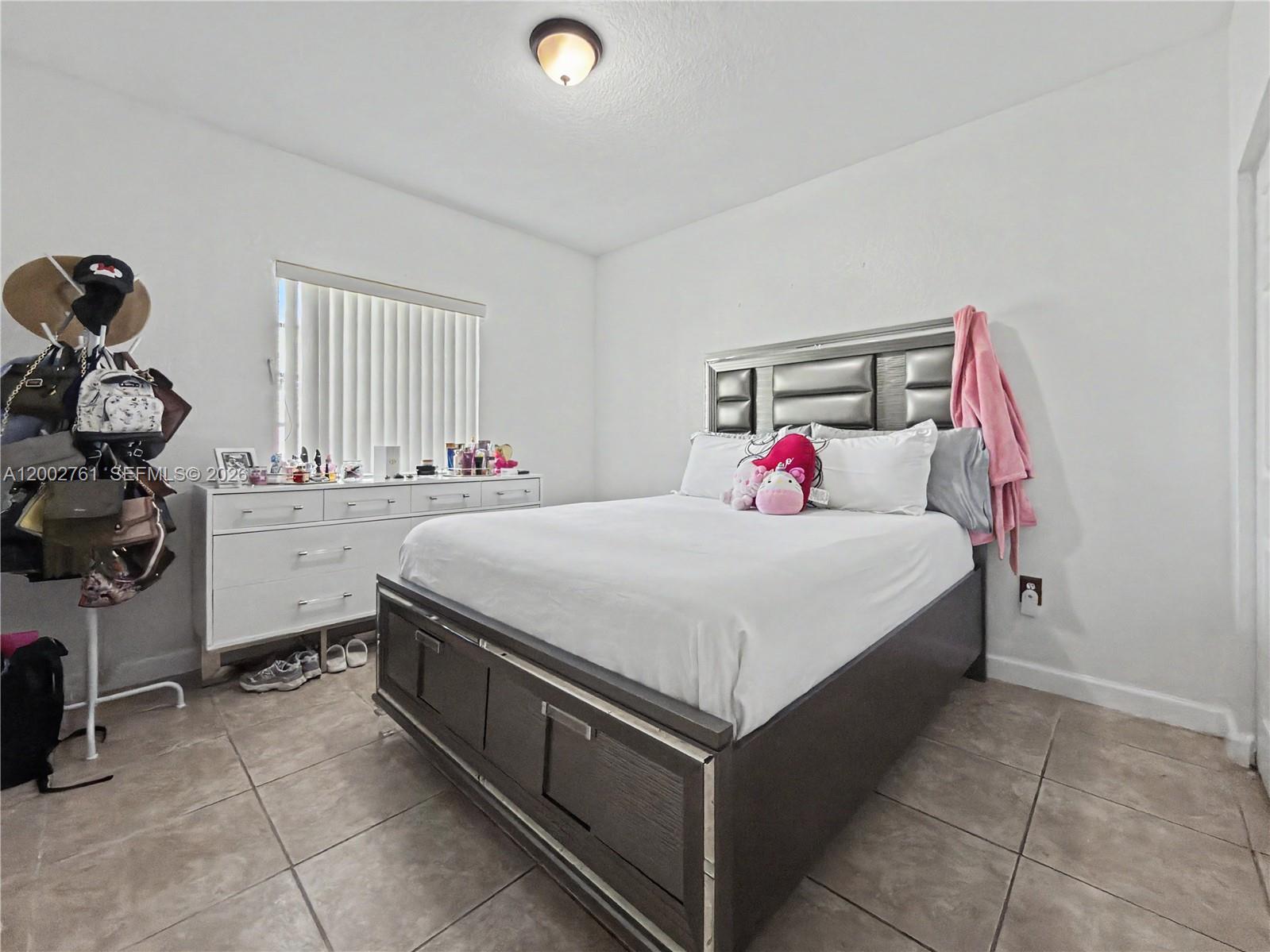14264 Southwest 289th Terrace Homestead, FL 33033 - Photo 13 of 23 a bedroom with a bed and a closet