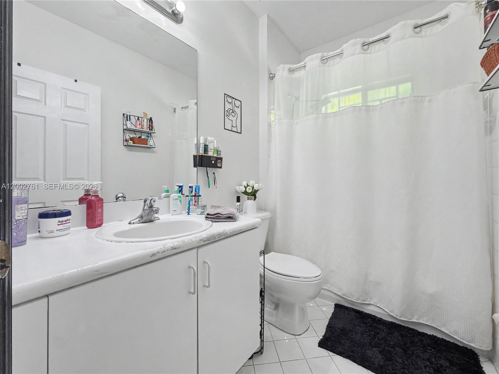 14264 Southwest 289th Terrace Homestead, FL 33033 - Photo 14 of 23 a bathroom with a sink toilet and shower