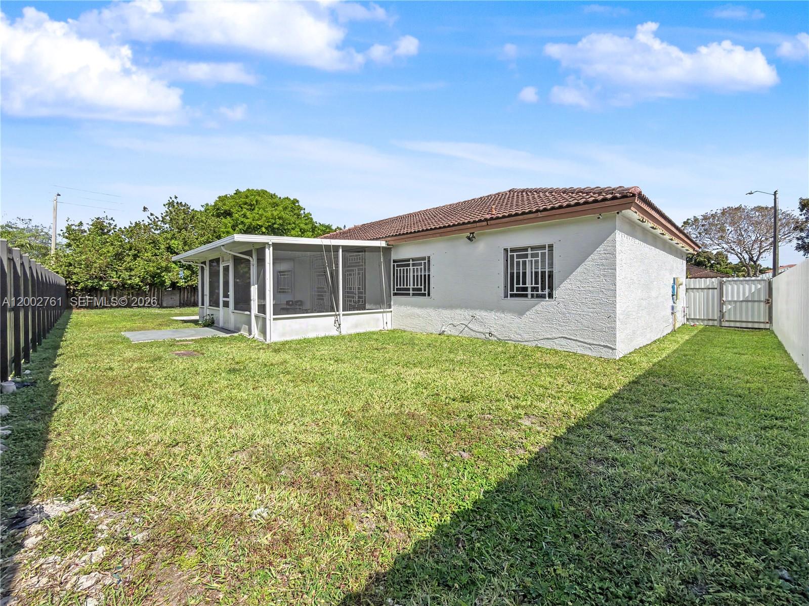 14264 Southwest 289th Terrace Homestead, FL 33033 - Photo 20 of 23 a view of a house with a backyard