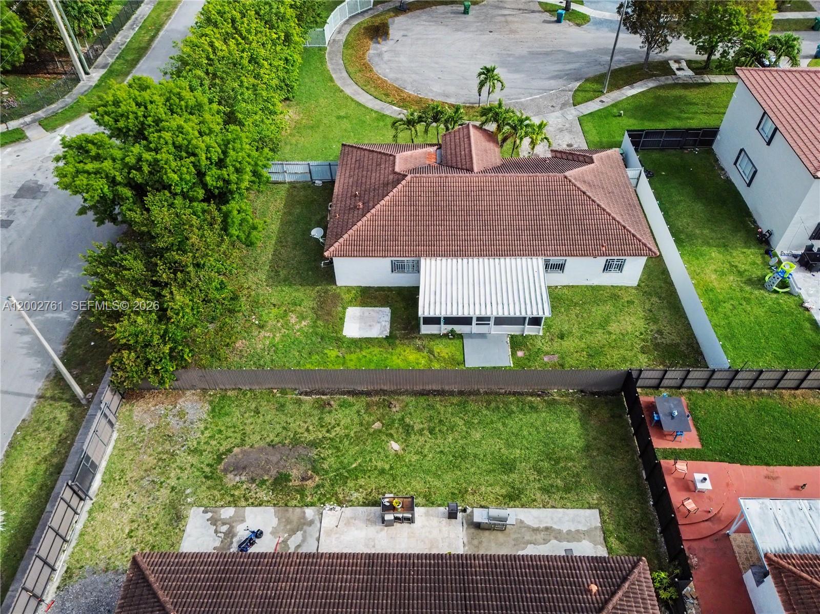 14264 Southwest 289th Terrace Homestead, FL 33033 - Photo 22 of 23 a aerial view of a house with garden