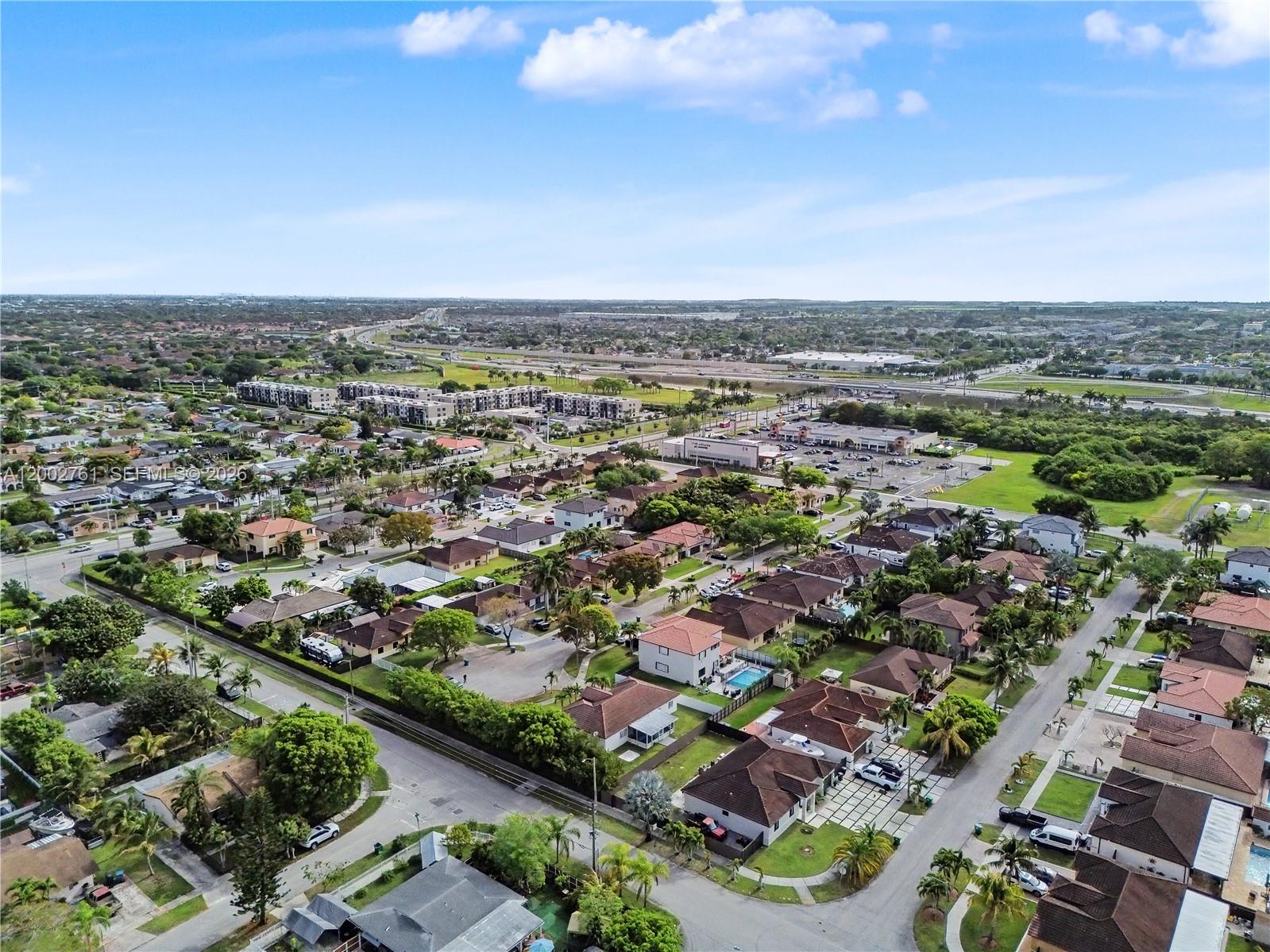 14264 Southwest 289th Terrace Homestead, FL 33033 - Photo 23 of 23 an aerial view of a city with lots of residential buildings