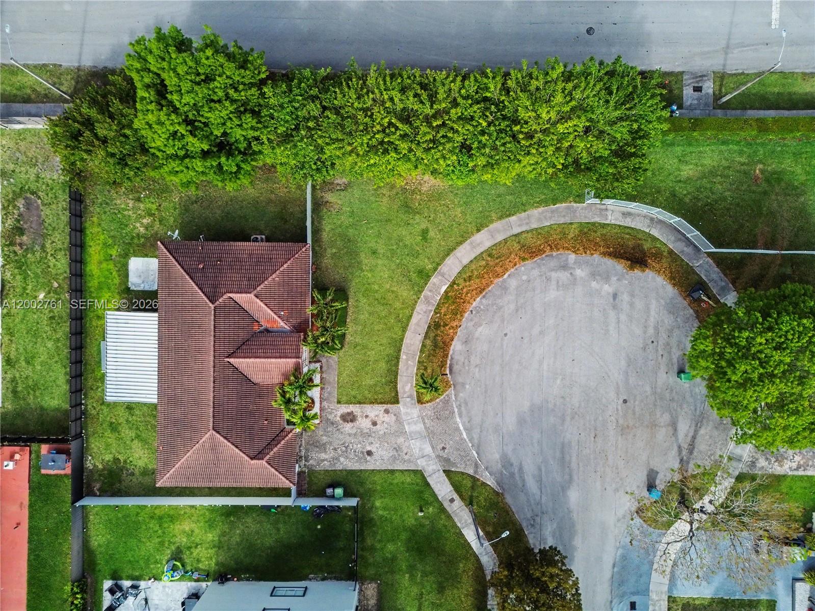 14264 Southwest 289th Terrace Homestead, FL 33033 - Photo 4 of 23 an aerial view of a house with a garden and trees