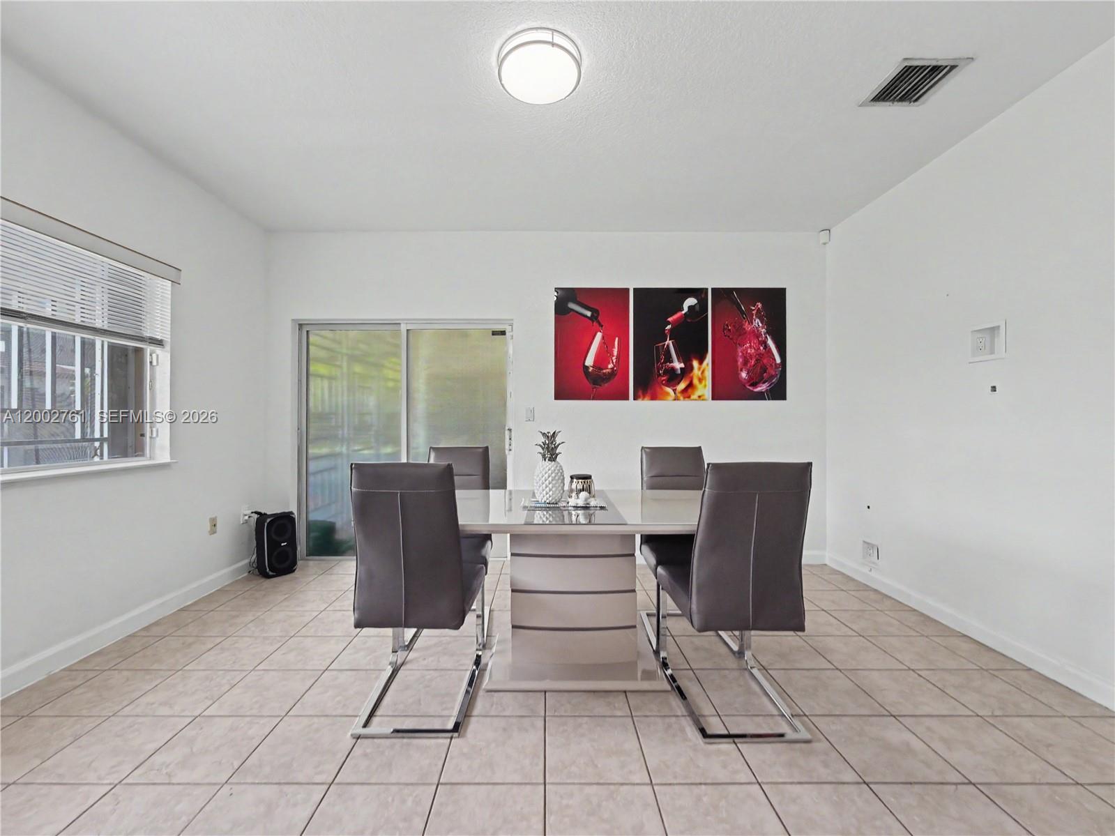 14264 Southwest 289th Terrace Homestead, FL 33033 - Photo 9 of 23 a living room with furniture and a window