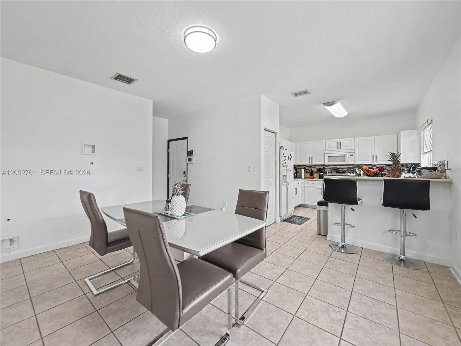 14264 Southwest 289th Terrace Homestead, FL 33033 - Photo 10 of 23 a view of a dining room with furniture