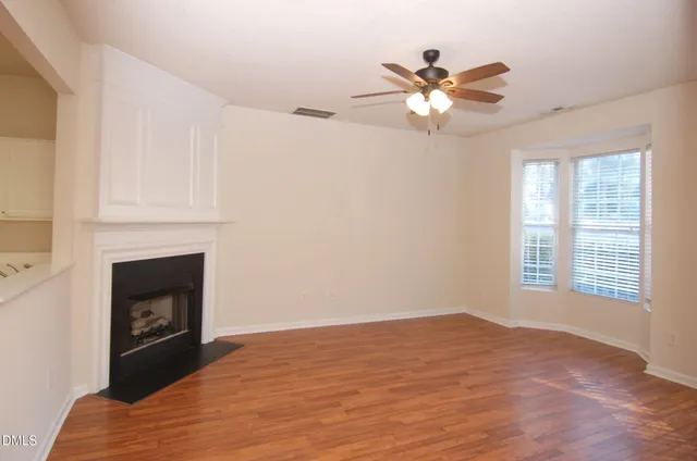a bedroom with a bed and a fireplace