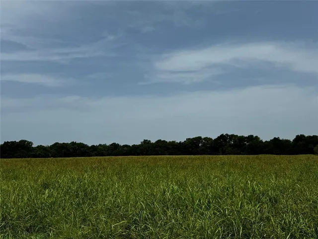a view of lake with mountain in the back