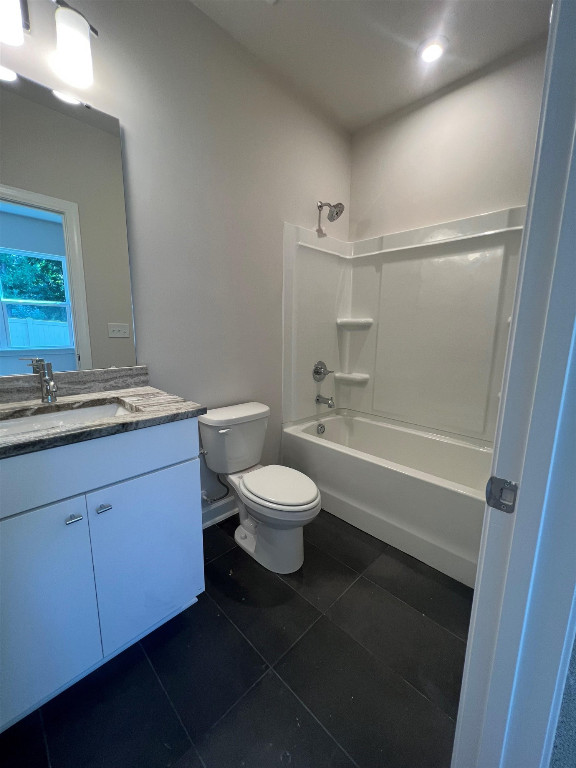 7809 Sofiana Avenue Raleigh, NC 27617 - Photo 13 of 20 a bathroom with a granite countertop toilet a sink and a mirror