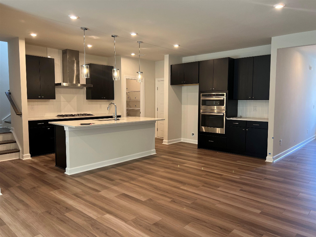 7809 Sofiana Avenue Raleigh, NC 27617 - Photo 15 of 20 a view of kitchen with stainless steel appliances granite countertop a stove and a sink