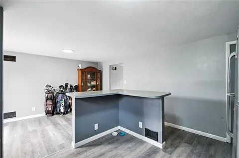 a view of storage and utility room with closet