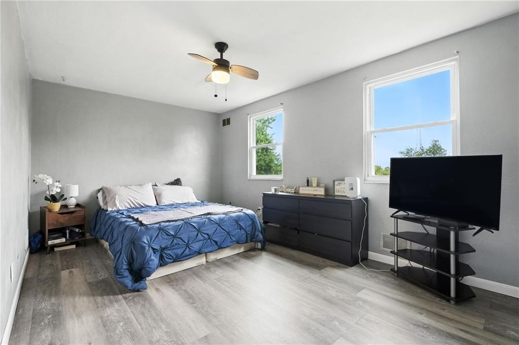 553 Indus Street Pittsburgh, PA 15207 - Photo 16 of 41 a bedroom with a bed and a flat screen tv