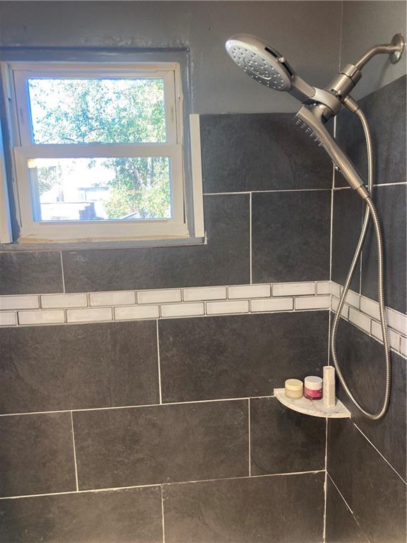 553 Indus Street Pittsburgh, PA 15207 - Photo 21 of 41 a bathroom with a window and a shower