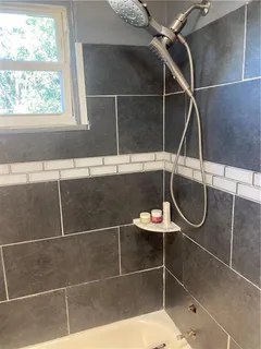 a room with table mirror and window