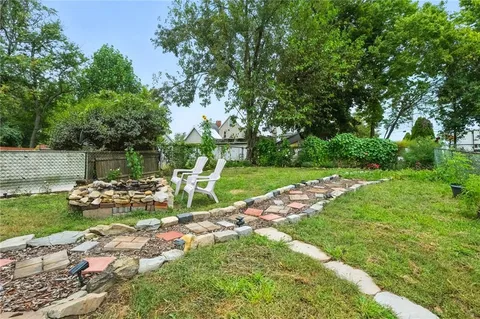 a view of green field with sitting area