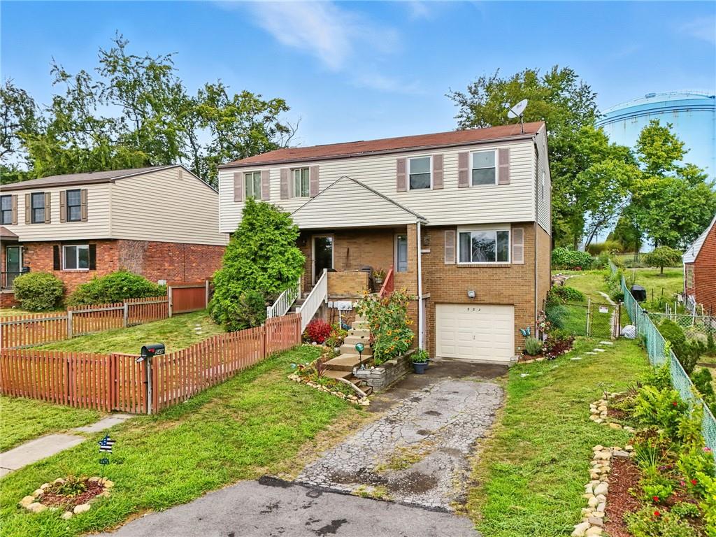 553 Indus Street Pittsburgh, PA 15207 - Photo 39 of 41 a view of a house with a yard and plants