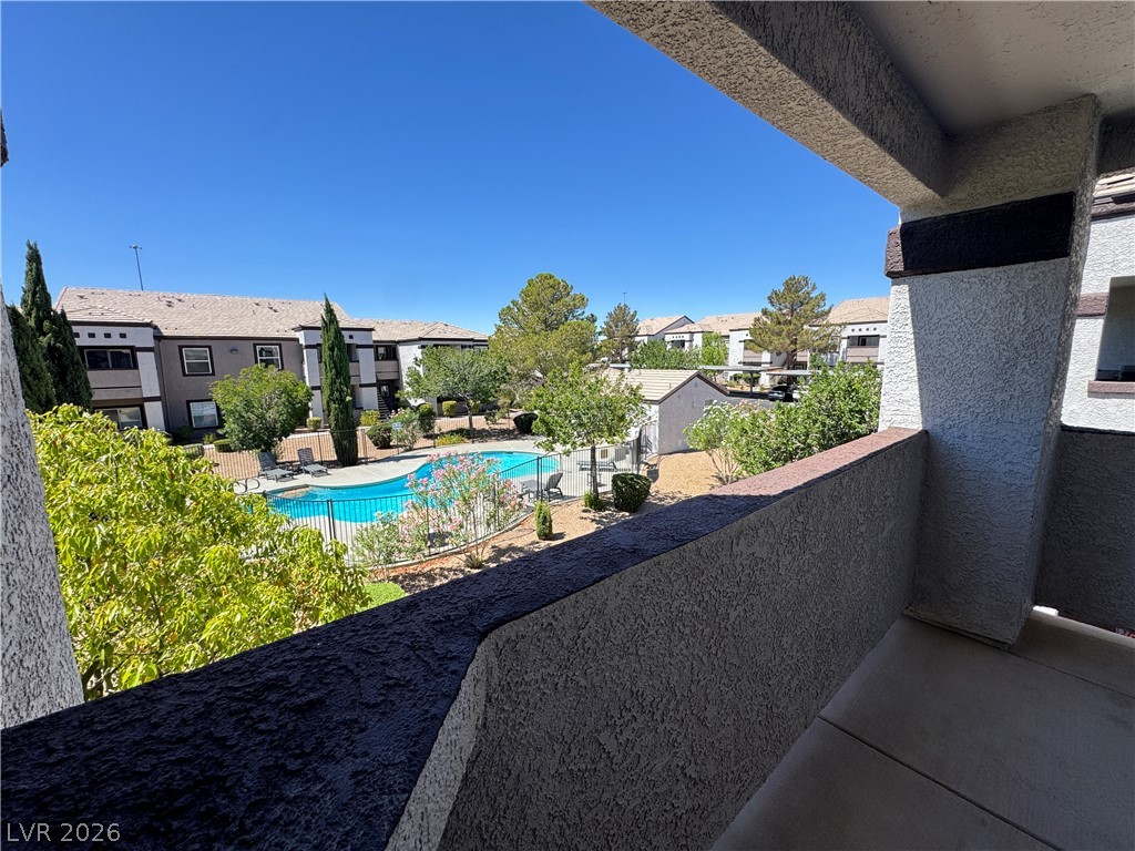 7255 West Sunset Road, Unit 2111 Las Vegas, NV 89113 - Photo 27 of 33 Enjoy tranquil views of the community pool and manicured grounds from this private balcony.