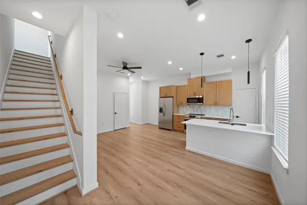 a kitchen with stainless steel appliances white cabinets and a stove