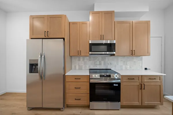 a kitchen with a sink and a refrigerator
