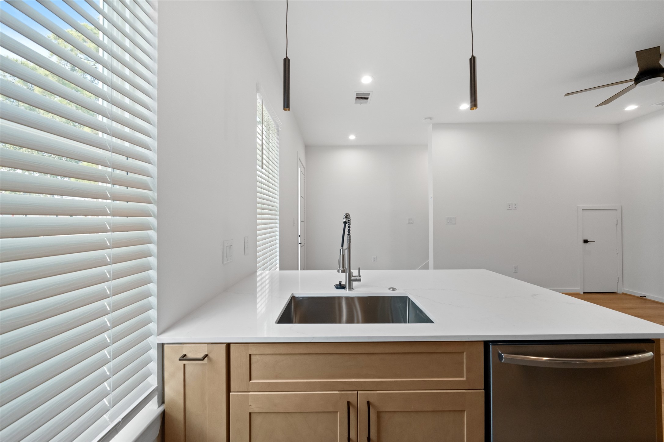 1408 Enid Street, Unit A Houston, TX 77009 - Photo 13 of 28 a kitchen with a sink and a refrigerator