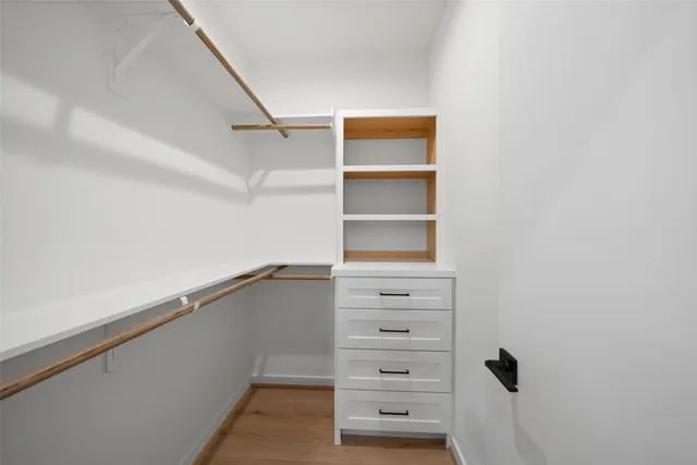 a bathroom with a double vanity sink mirror and bathtub