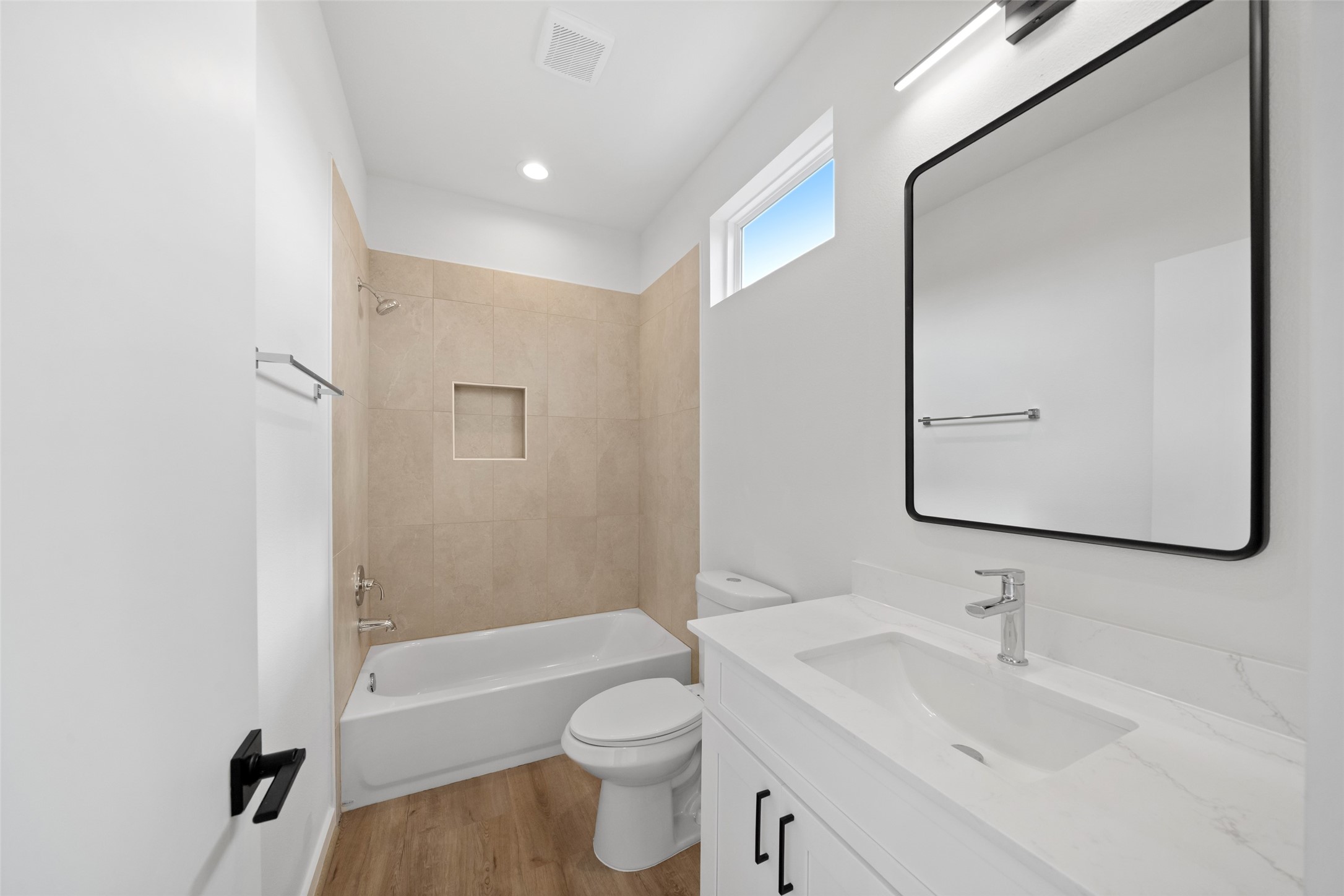 1408 Enid Street, Unit A Houston, TX 77009 - Photo 20 of 28 a bathroom with a bathtub shower sink vanity mirror and toilet