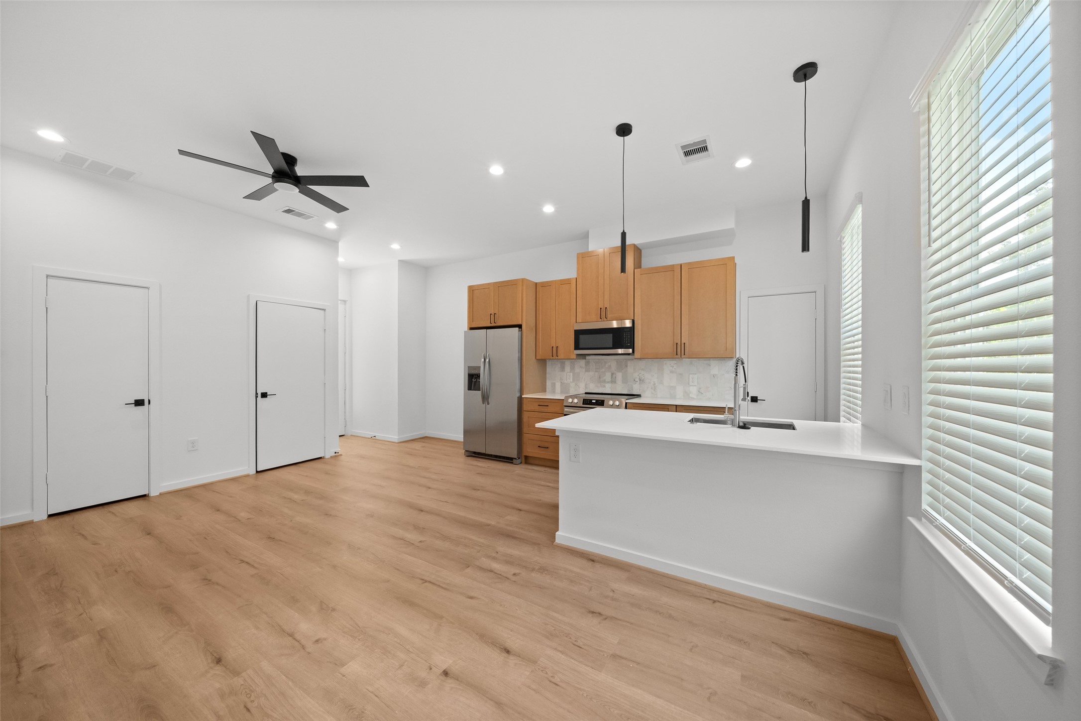 1408 Enid Street, Unit A Houston, TX 77009 - Photo 10 of 28 a view of kitchen with sink and refrigerator