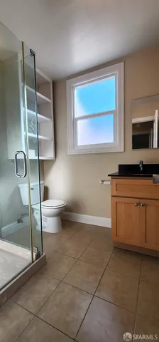 a kitchen with a stove a microwave and a sink