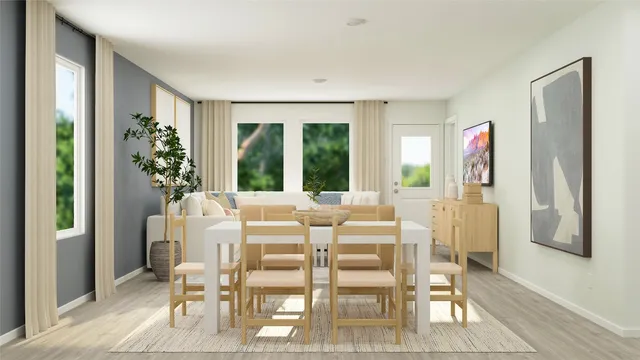 a view of a dining room with furniture window and outside view