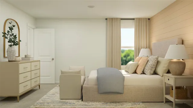 a bedroom with a bed and a chair