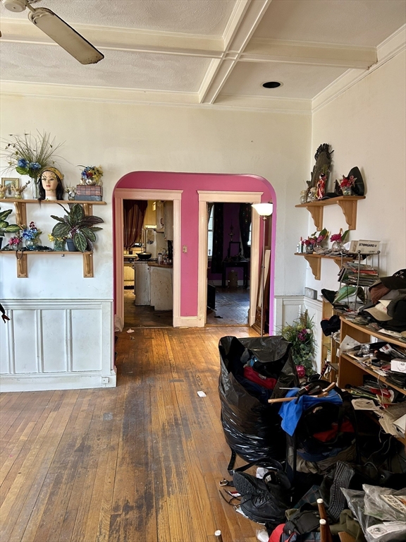 110 Bellingham Street, Unit 1 Chelsea, MA 02150 - Photo 11 of 17 a living room with furniture and a mirror