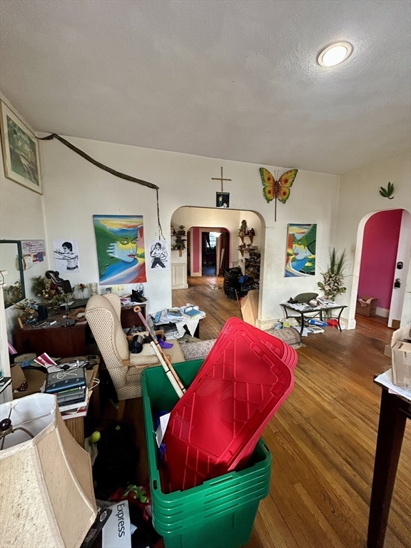 110 Bellingham Street, Unit 1 Chelsea, MA 02150 - Photo 4 of 17 a living room with furniture a rug and a fireplace