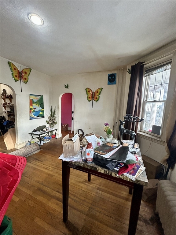 110 Bellingham Street, Unit 1 Chelsea, MA 02150 - Photo 5 of 17 a living room with furniture and wooden floor