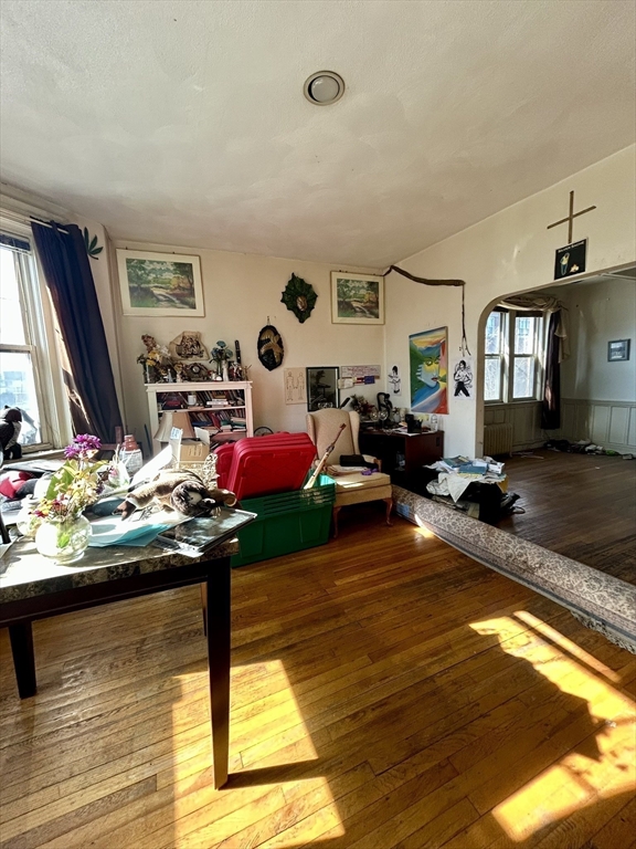 110 Bellingham Street, Unit 1 Chelsea, MA 02150 - Photo 6 of 17 a living room with furniture and a table
