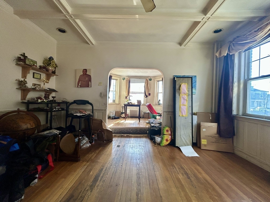 110 Bellingham Street, Unit 1 Chelsea, MA 02150 - Photo 8 of 17 a living room with furniture and a wooden floor