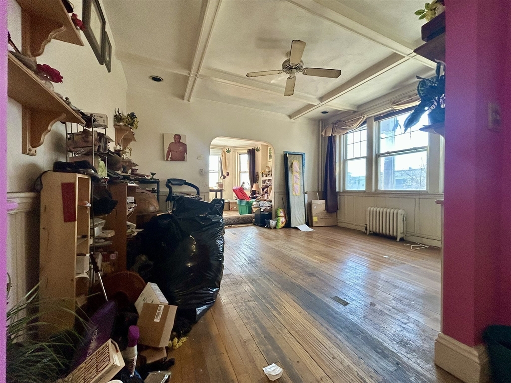 110 Bellingham Street, Unit 1 Chelsea, MA 02150 - Photo 9 of 17 a living room with furniture and a window