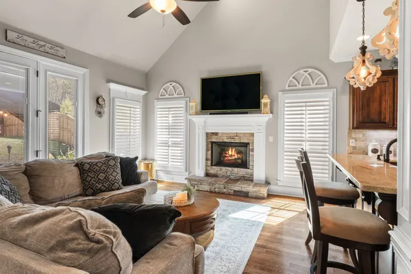a living room with furniture fireplace and a flat screen tv